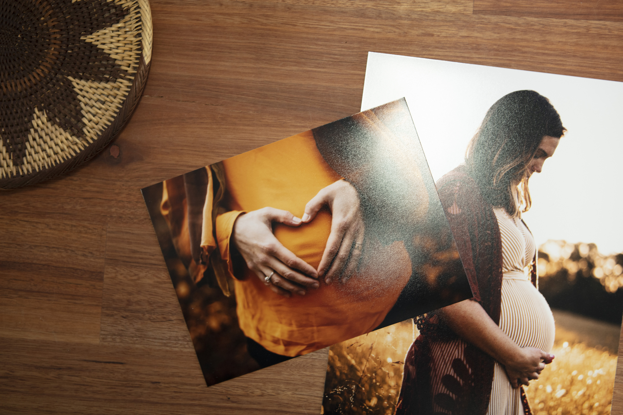 Two prints of pregnant woman on lustre photo paper