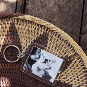Photo keyring of a woman and her dog in black and white