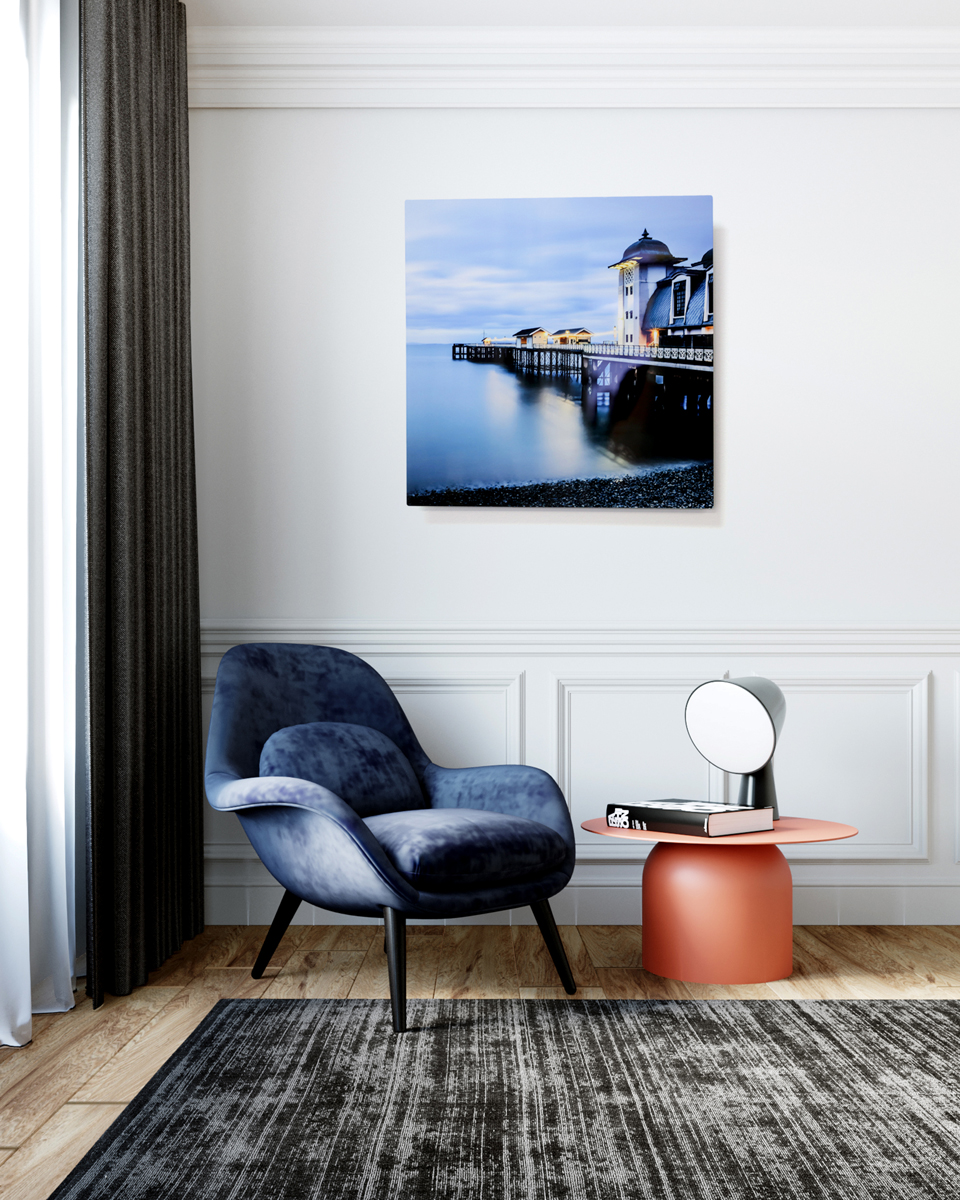 Aluminium print of a jetty with smooth water on the wall of a modern lounge room
