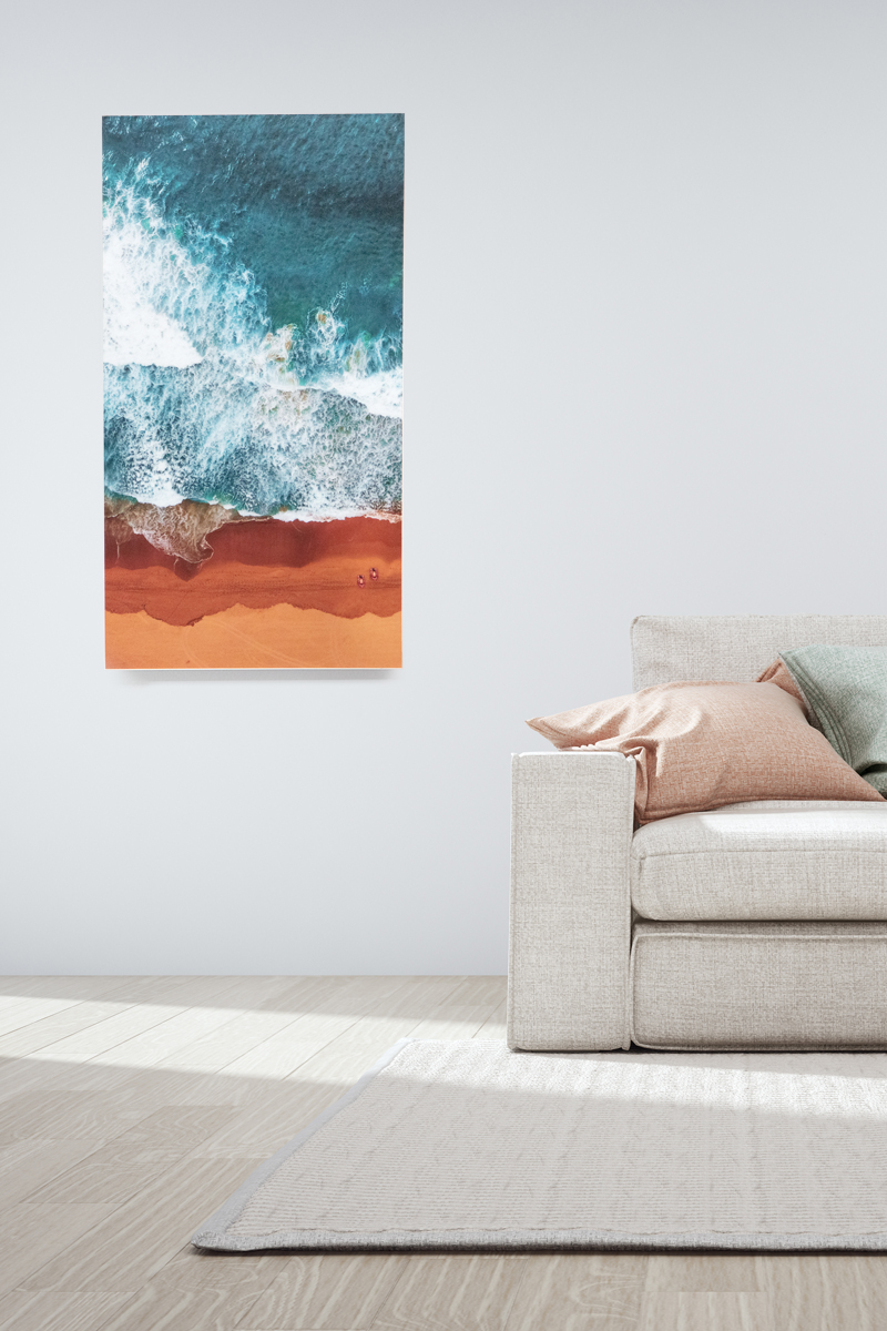 20mm white edge foam core print of a beach on a wall in a modern lounge room