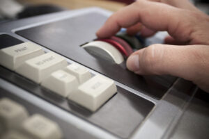 Hand using specialty colour correcting equipment in the photo lab