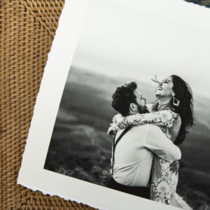 Textured canson aquarelle rag black and white print of bride and groom with a white border and torn edge