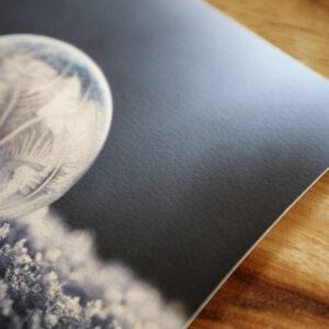 Close up of print of frozen bubble on slightly textured canson edition etching paper