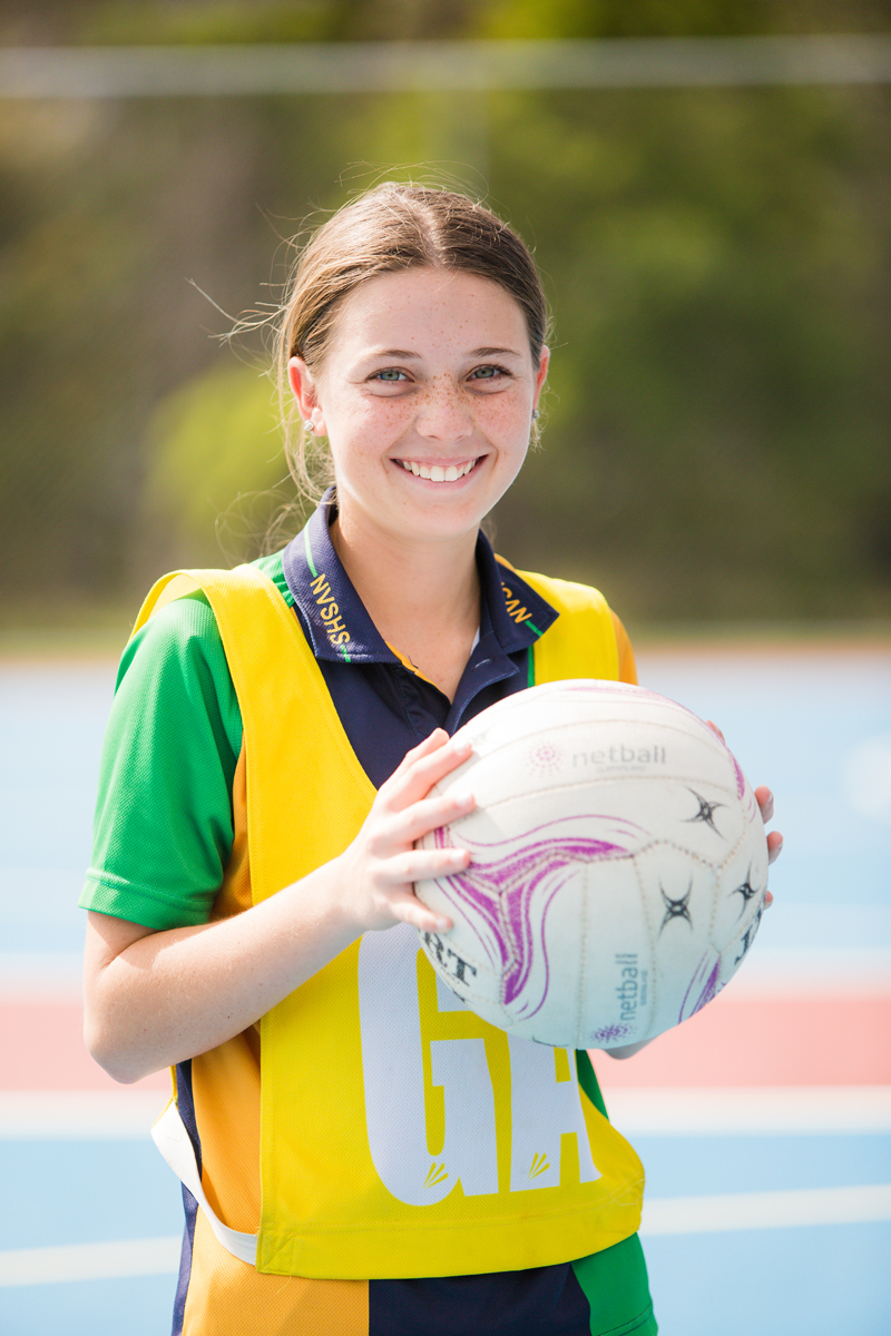 Professional portrait of a school girl playing netball
