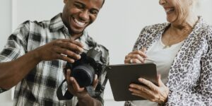 Photographer showing a woman images on the back of a DSLR