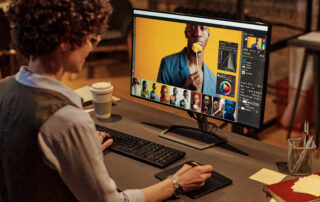 Photographer working in Adobe1998 and sRGB colour spaces, editing images on a desktop for professional photo printing workflow.