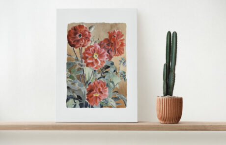 Canvas wall art on a wooden shelf with cactus Selling Prints Online? A Better Way to Handle Fulfilment with Shopify & WooCommerce